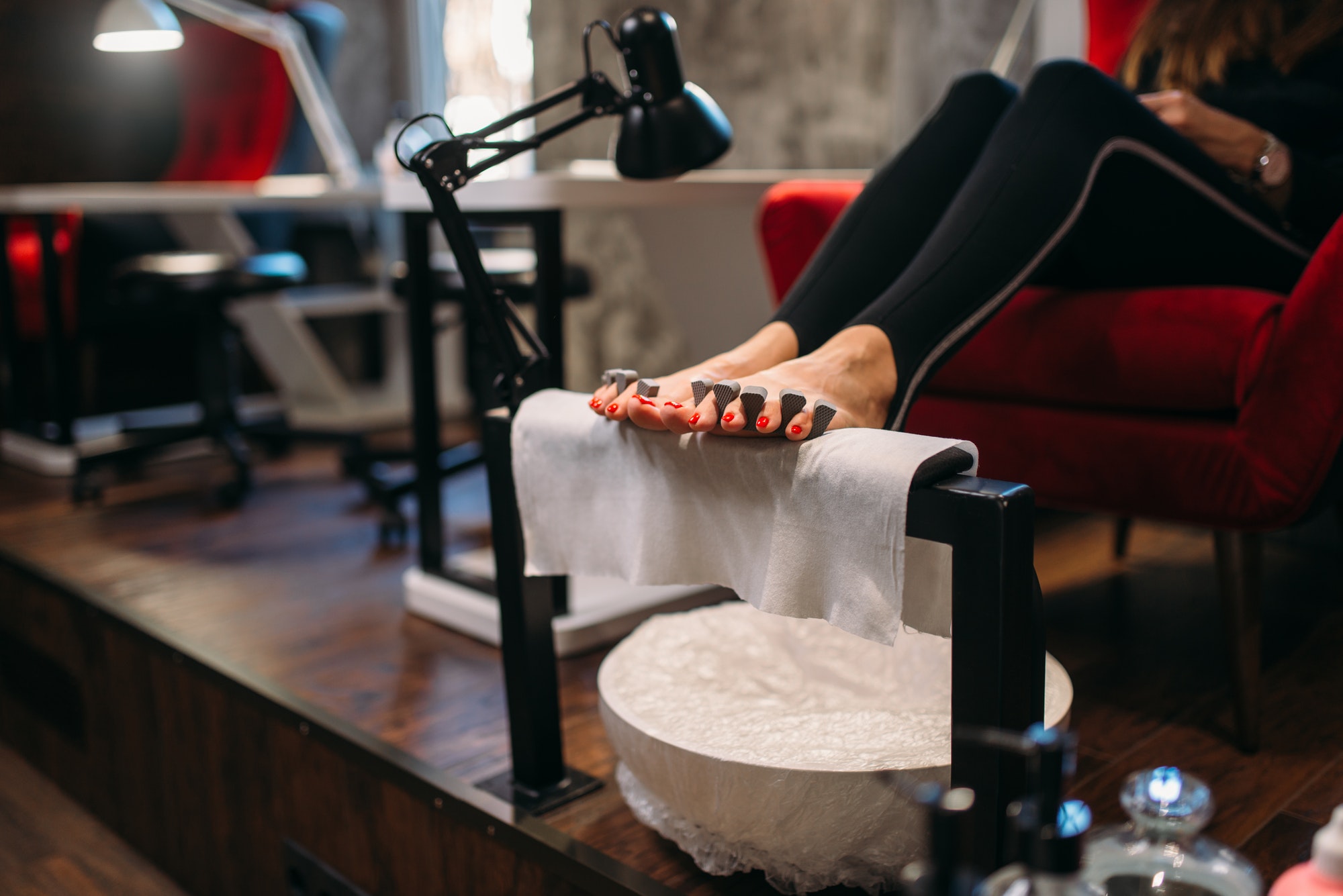 Female client on pedicure procedure, beauty salon